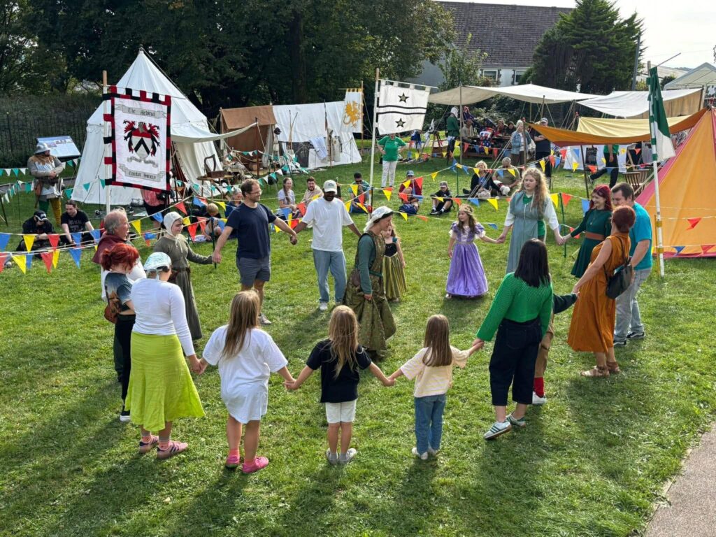 The public are invited in to take part in a medieval dance display