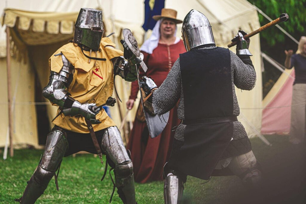 two knights battle each other in combat with maces
